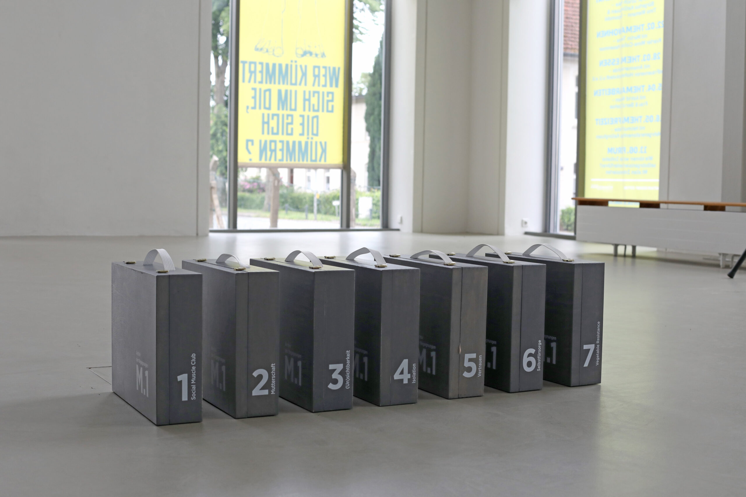 seven grey suitcases that are the Archive of Encounters at M.1. Hohenlockstedt