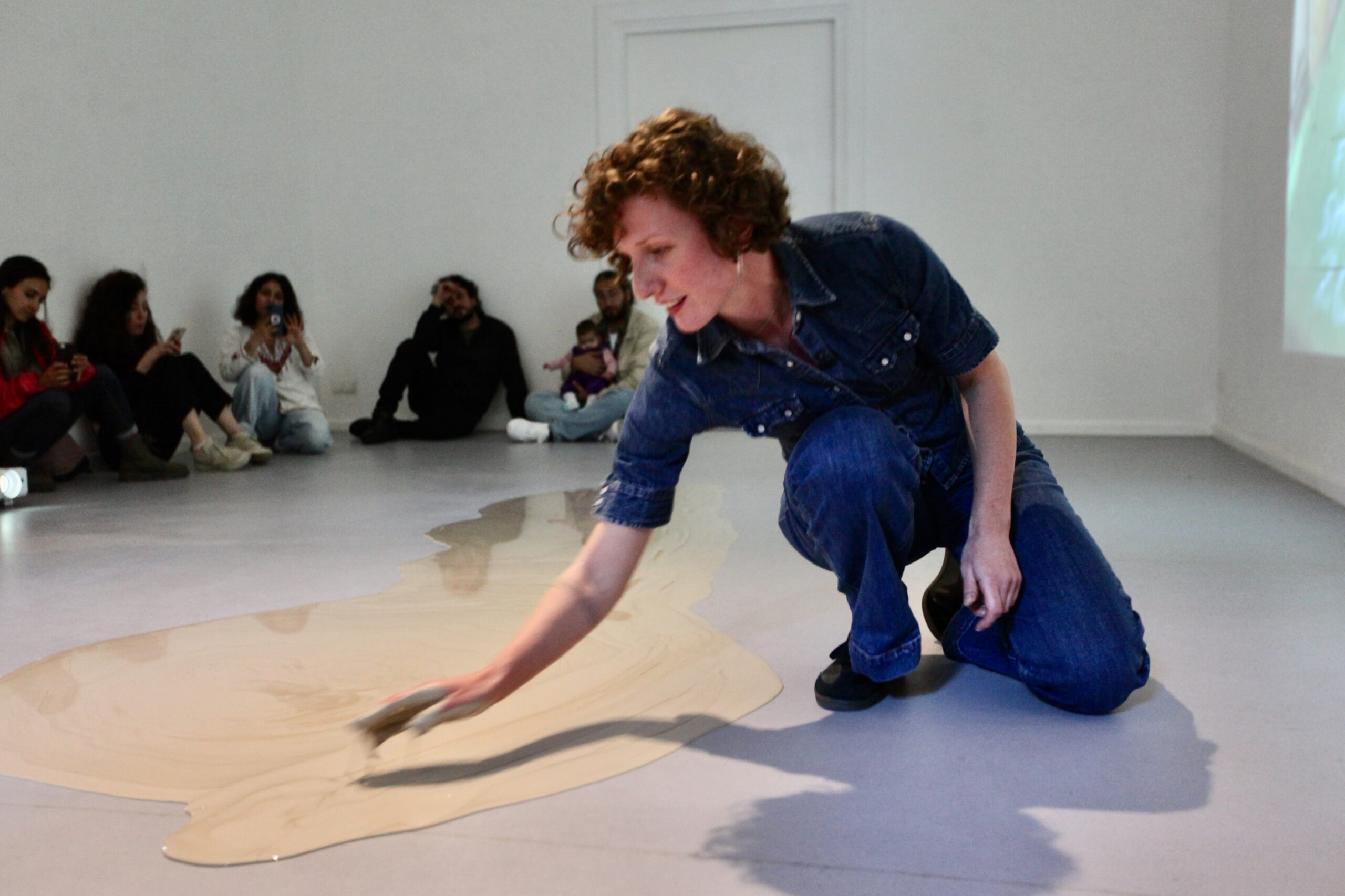 artist Laura Mahnke during her action pouring